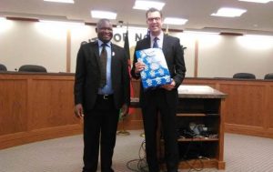 Blantyre City Wild Ndipo on the left to welcome Norfolk City Mayor Josh Moenning